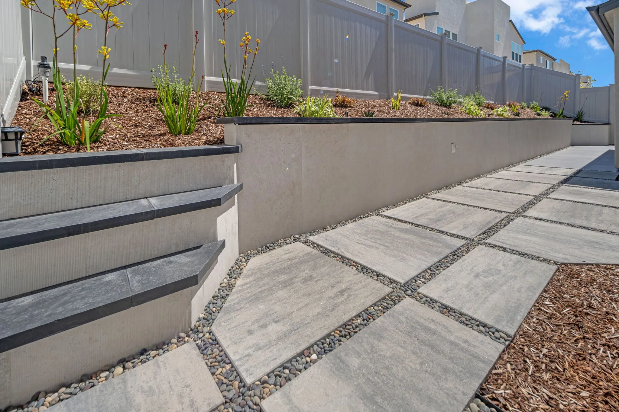 Westside Scapes paving work — a finished bluestone pathway